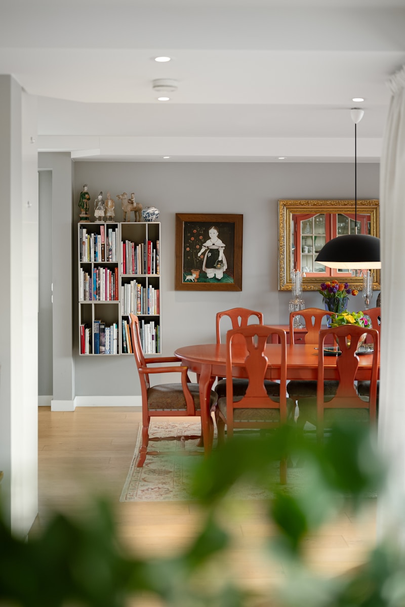 A dining room with a table and chairs